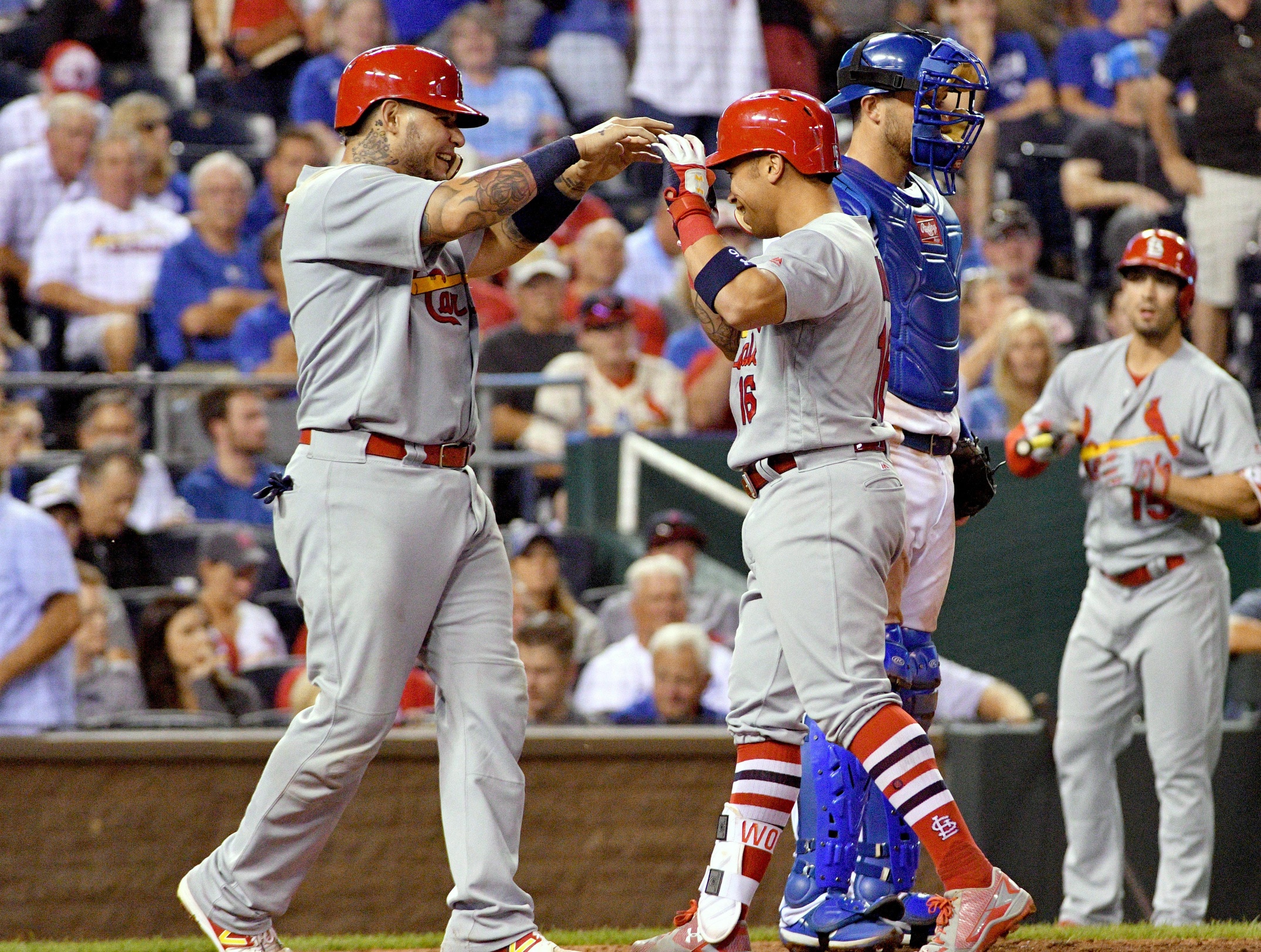 Aug 7, 2017; Kansas City, MO, USA; St. Louis Cardinals second baseman Kolten Wong (16) is congratulated by catcher Yadier Molina (4) after hitting a two run home run in the eighth inning against the Kansas City Royals at Kauffman Stadium. Mandatory Credit: Denny Medley-USA TODAY Sports