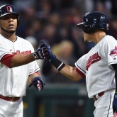 Aug 24, 2017; Cleveland, OH, USA; Cleveland Indians first baseman Edwin Encarnacion (10) and third baseman Giovanny Urshela (39) celebrate after Encarnacion scored during the third inning against the Boston Red Sox at Progressive Field. Mandatory Credit: Ken Blaze-USA TODAY Sports