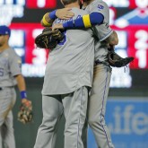 Sep 1, 2017; Minneapolis, MN, USA; Kansas City Royals third baseman Mike Moustakas (8) and first baseman Eric Hosmer (35) celebrate their win over the Minnesota Twins at Target Field. Mandatory Credit: Bruce Kluckhohn-USA TODAY Sports