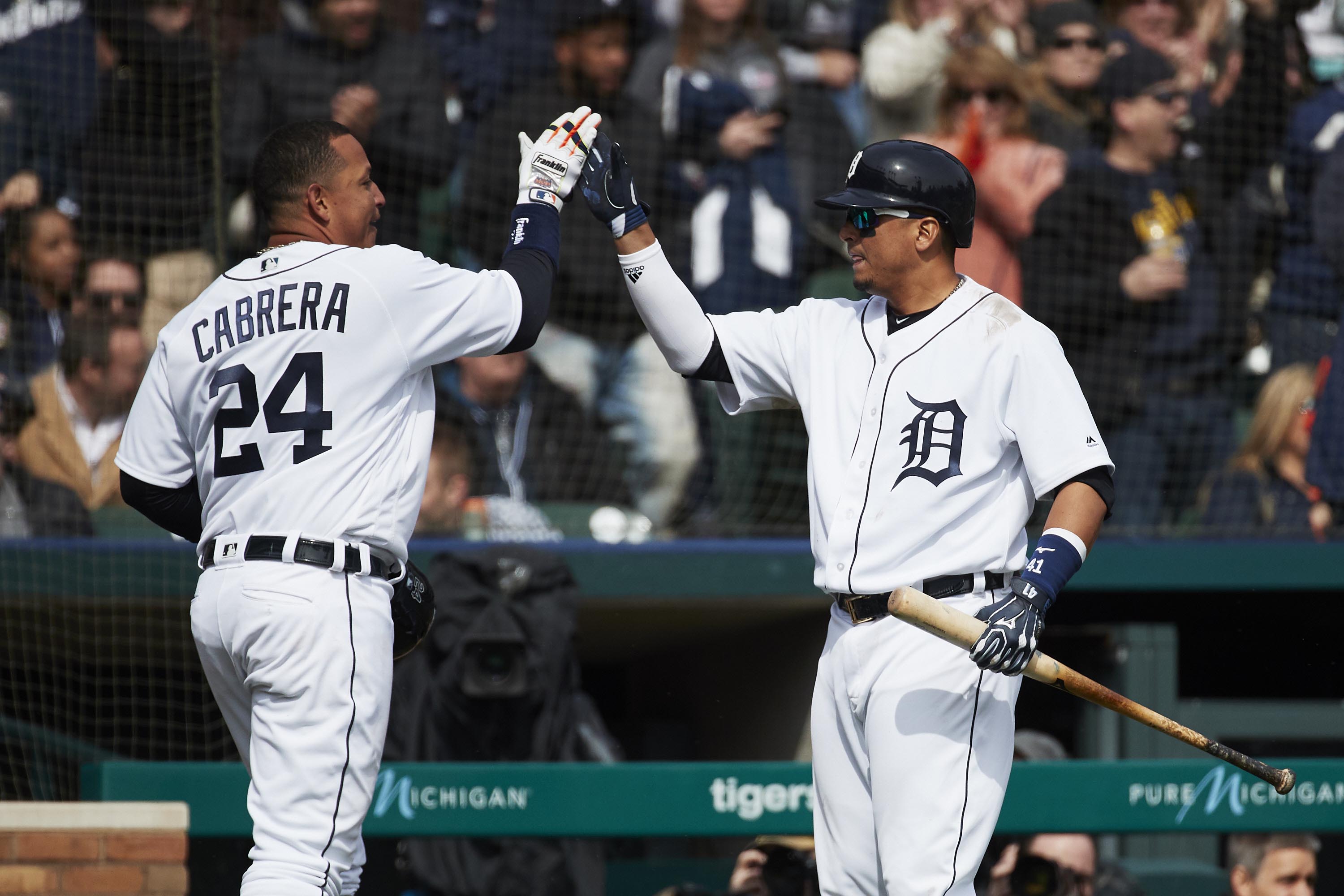 Mar 30, 2018; Detroit, MI, USA; Detroit Tigers first baseman Miguel Cabrera (24) receives congratulations from designated hitter Victor Martinez (41) after scoring in the seventh inning against the Pittsburgh Pirates at Comerica Park. Mandatory Credit: Rick Osentoski-USA TODAY Sports