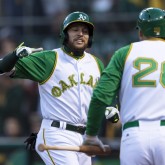 Apr 17, 2018; Oakland, CA, USA; Oakland Athletics second baseman Jed Lowrie (8) celebrates with first baseman Matt Olson (28) after hitting a solo home run against the Chicago White Sox in the first inning at Oakland Coliseum. Mandatory Credit: John Hefti-USA TODAY Sports