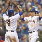 Jun 15, 2018; Milwaukee, WI, USA; Milwaukee Brewers right fielder Christian Yelich (22) is greeted by center fielder Lorenzo Cain (6) after hitting a home run during the fourth inning against the Philadelphia Phillies at Miller Park. Mandatory Credit: Jeff Hanisch-USA TODAY Sports